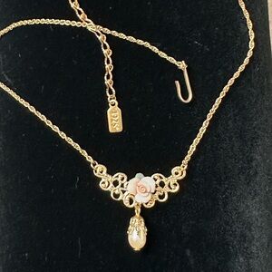 1928 Gold Tone Floral Drop Necklace with Pink Porcelain Rose Accent